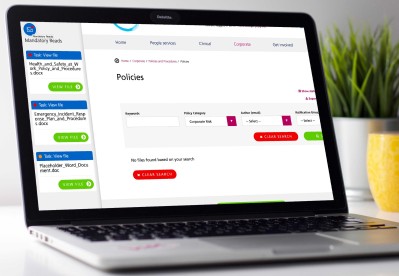 A laptop screen showing an NHS document management system developed by Frank