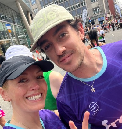 The Frank team wearing branded t-shirts, in the sunshine, smiling at the camera