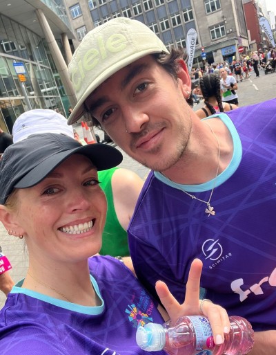 The Frank team wearing branded t-shirts, in the sunshine, smiling at the camera